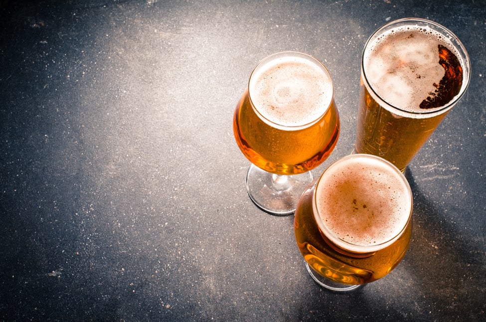 Beer glasses on dark table